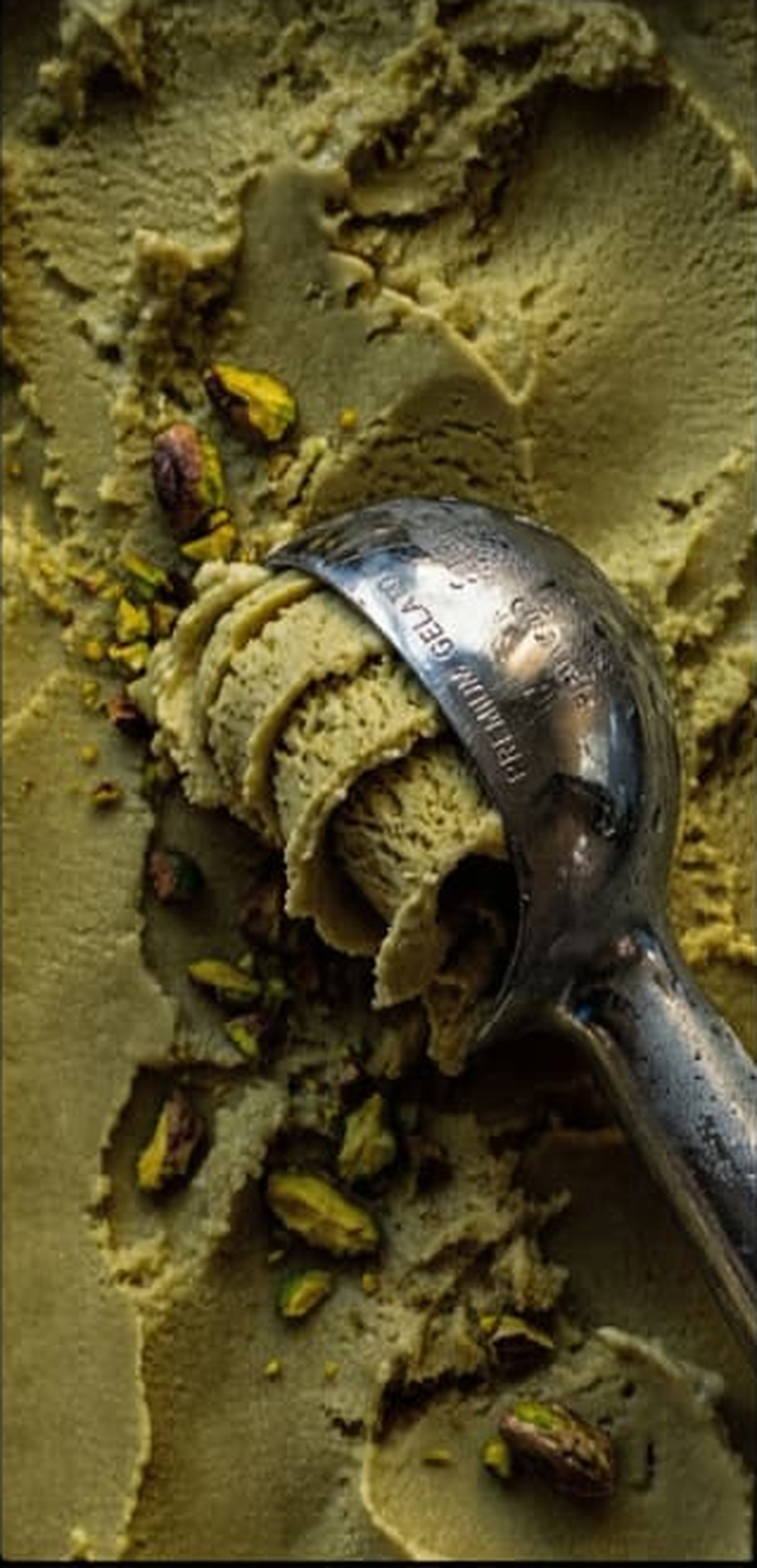 Sculptural pistachio texture and metal scoop