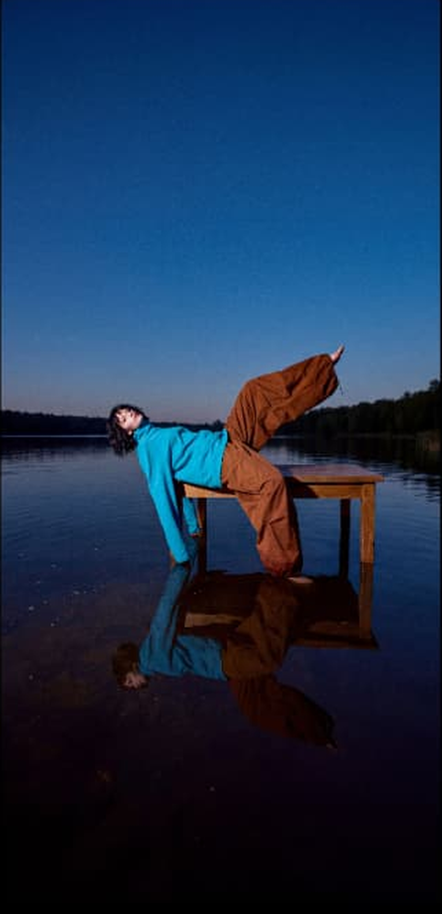 Fashion portrait over reflective water