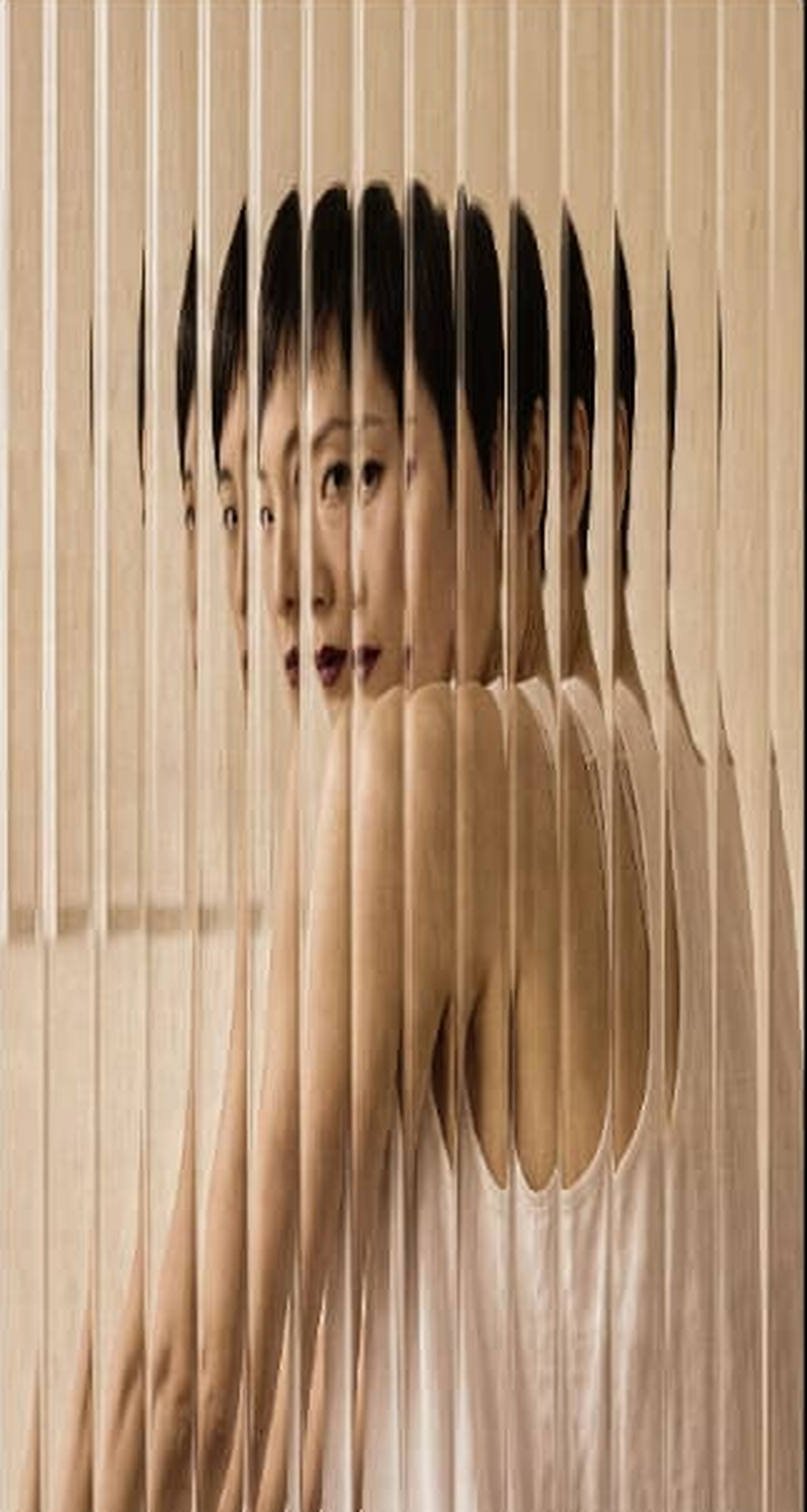 Portrait refracted through vertical glass