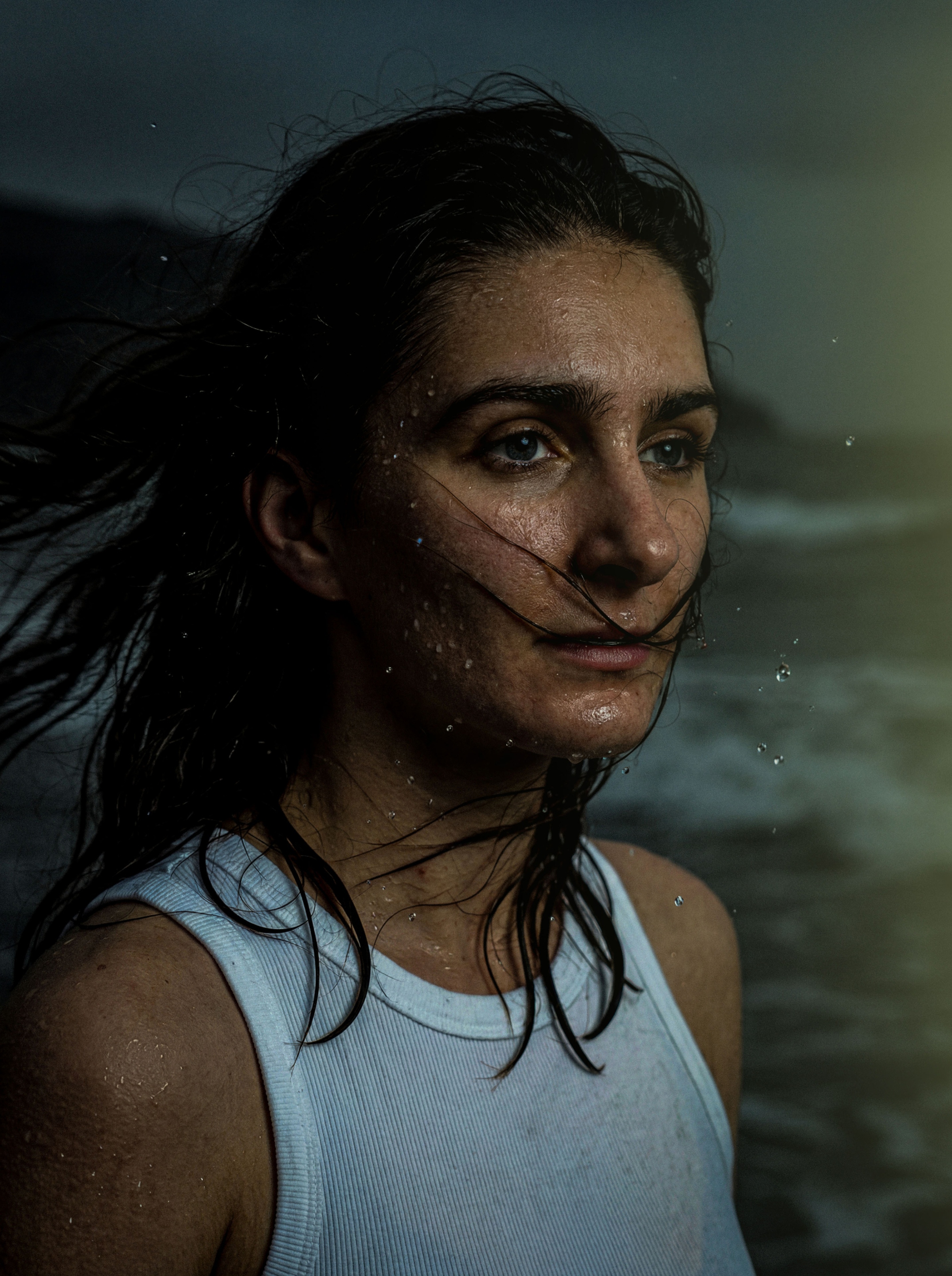 Rain-soaked portrait by the sea