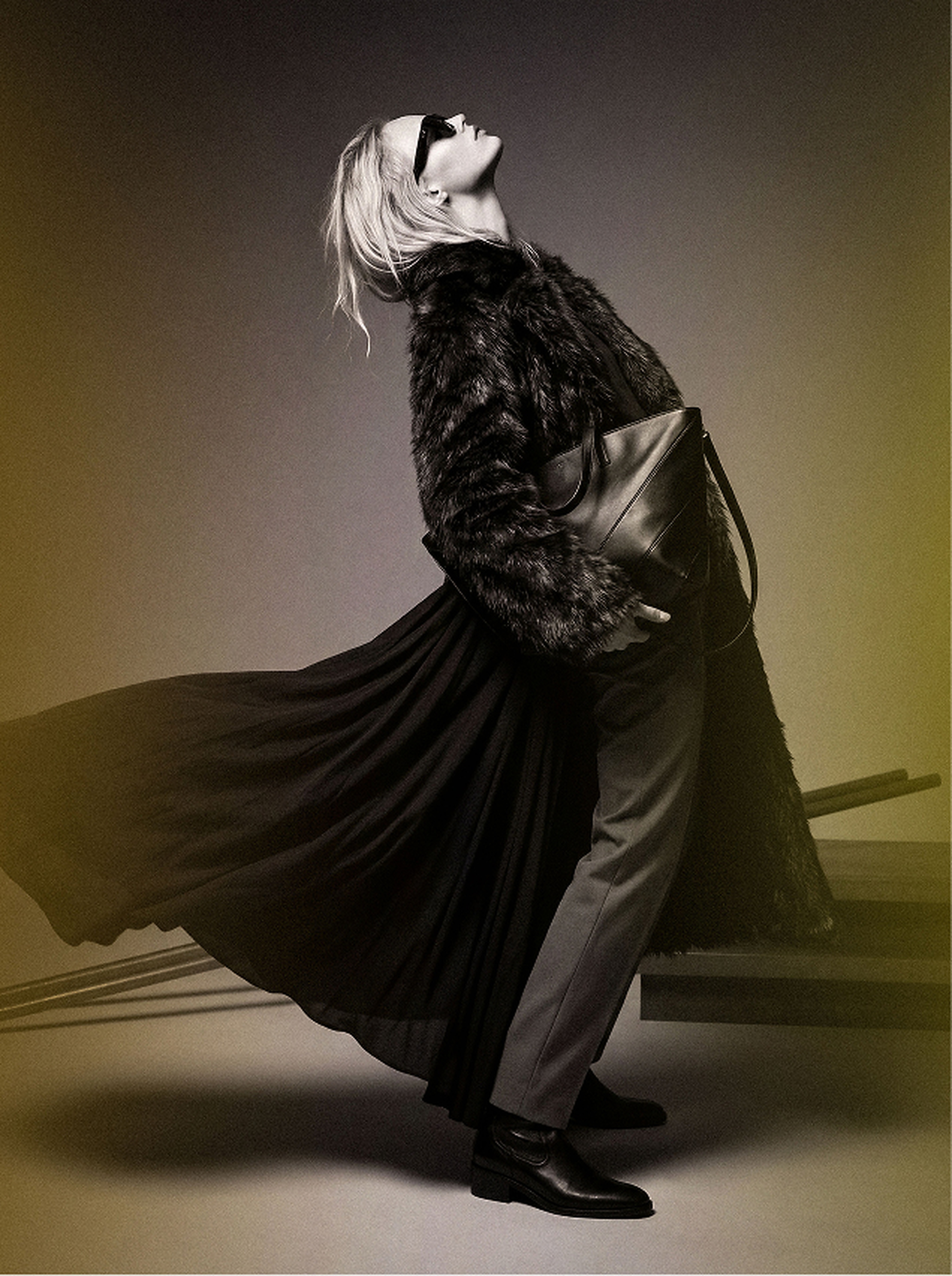 Editorial figure with faux fur coat and leather tote