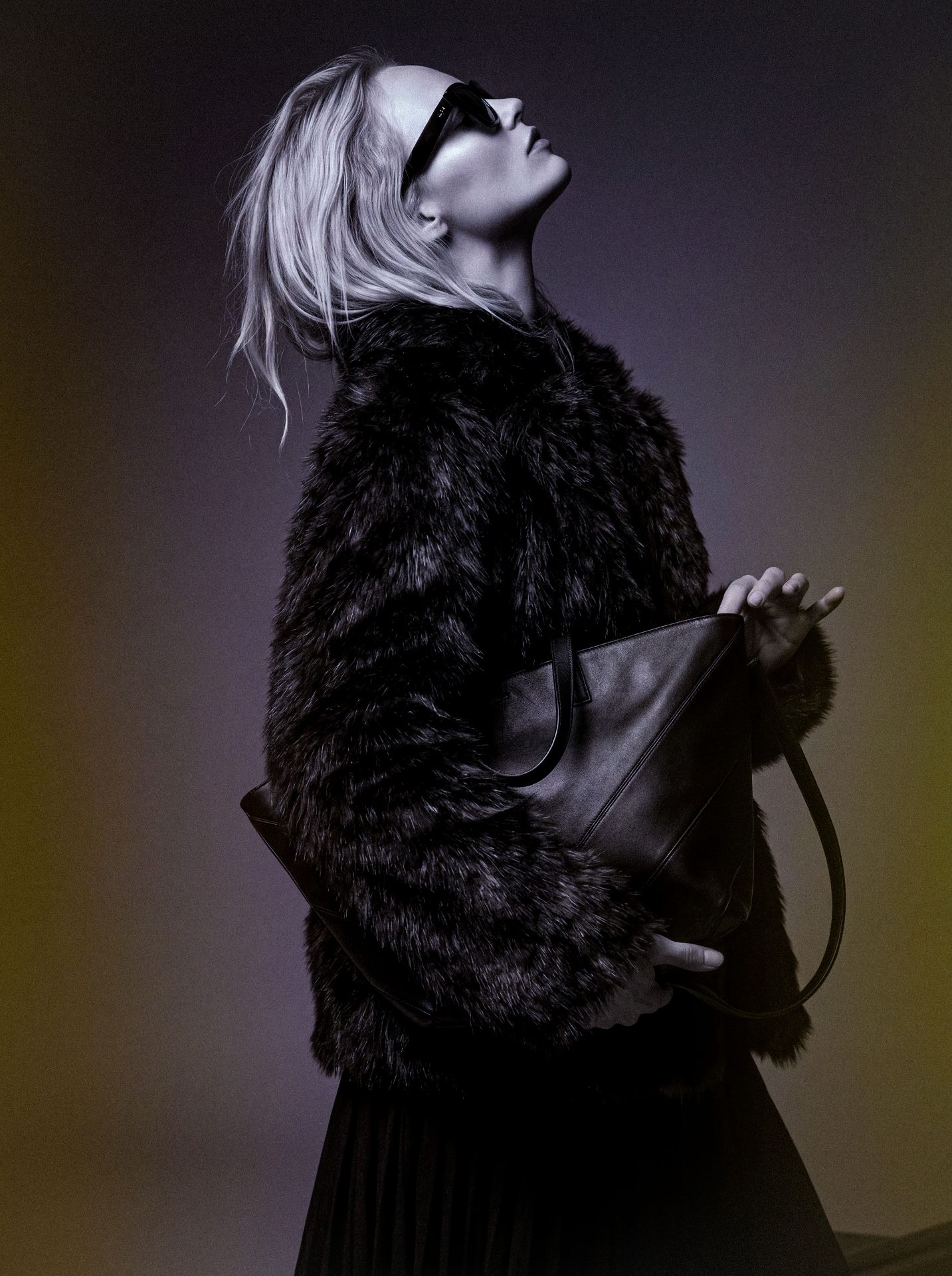 Portrait in faux fur coat and sunglasses